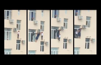 Homem salva menino pendurado em prédio na Rússia